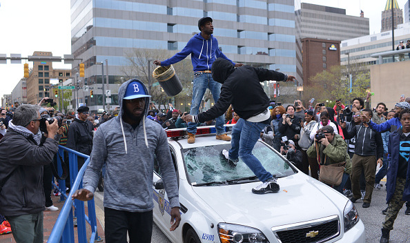 Hundreds march through the streets of Baltimore protesting the death of Freddie Gray.